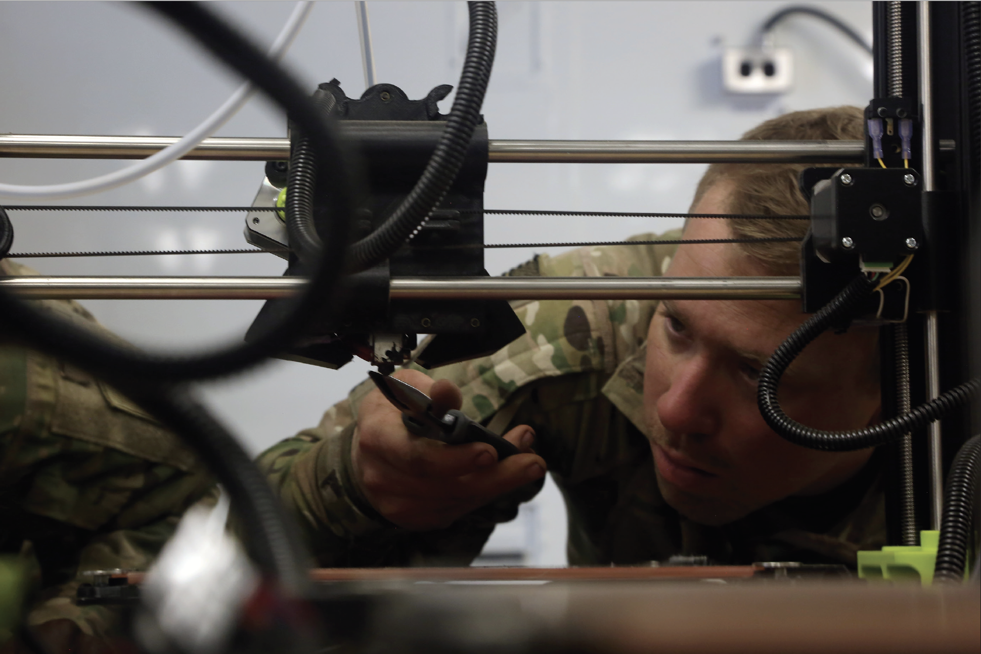 Army Private 1st Class Jimmy Roe, assigned to Bravo Company, 299th Battalion Support Brigade, Dagger Brigade, services Lulzbot Taz 2 Hard Plastic 3D Printer, part of Rapid Fabrication via Additive Manufacturing on the Battlefield, at Amberg Training Area, Amberg, Germany, May 4, 2018 (U.S. Army/Elliott Page)